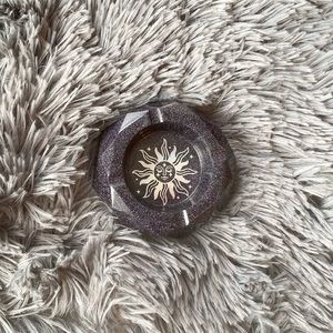 Holographic handmade sun ashtray.